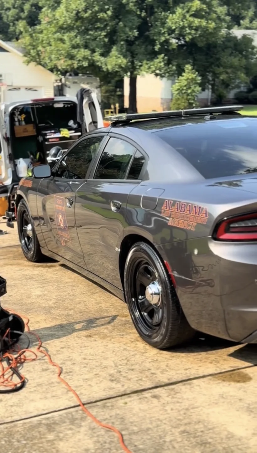 Alabama state trooper Charger beside the mobile rig